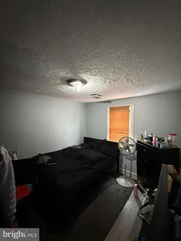 a bedroom with a bed and furniture