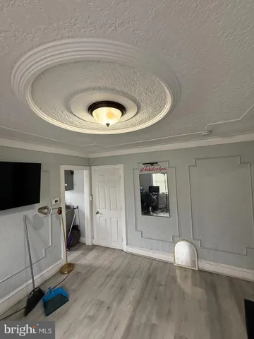 a view of livingroom with furniture and wooden floor