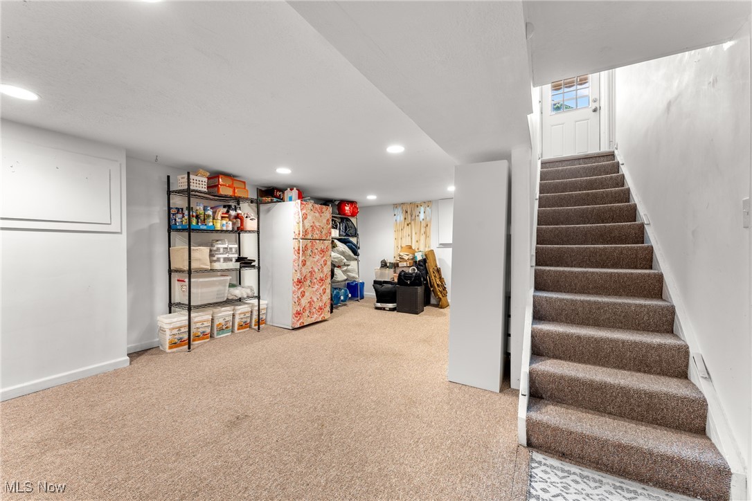 1515 Deville Avenue Northwest Canton, OH 44708 - Photo 29 of 42 Finished basement featuring stairs, recessed lighting, and carpet floors