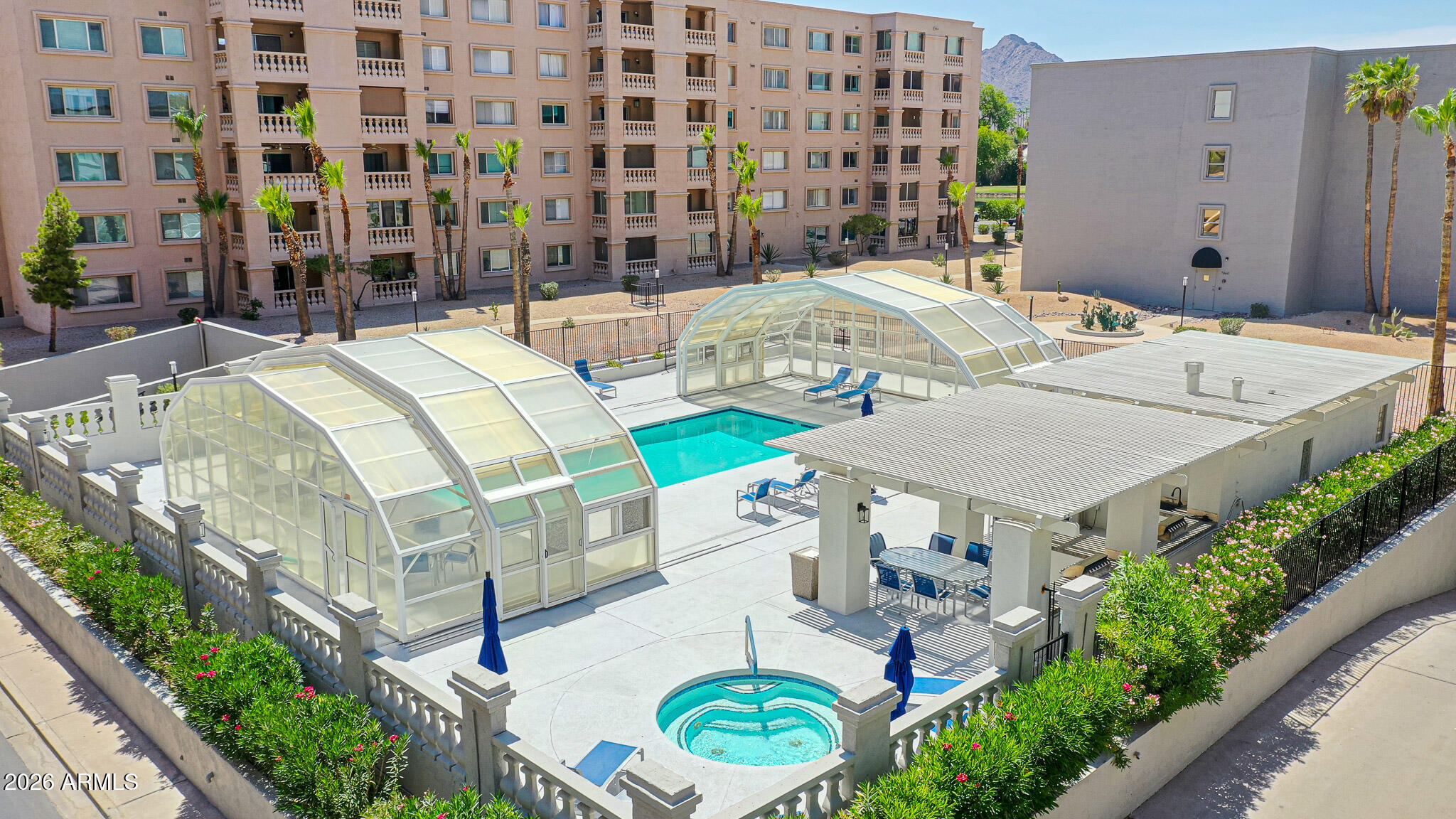 7920 East Camelback Road, Unit 111 Scottsdale, AZ 85251 - Photo 24 of 32 a view of a swimming pool with outdoor seating