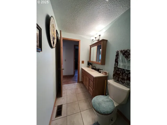 a living room with furniture and a mirror