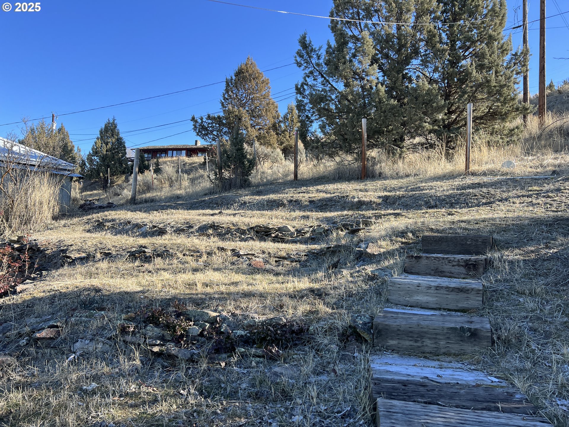 304 Hillcrest Drive John Day, OR 97845 - Photo 37 of 38 a view of a yard with wooden fence