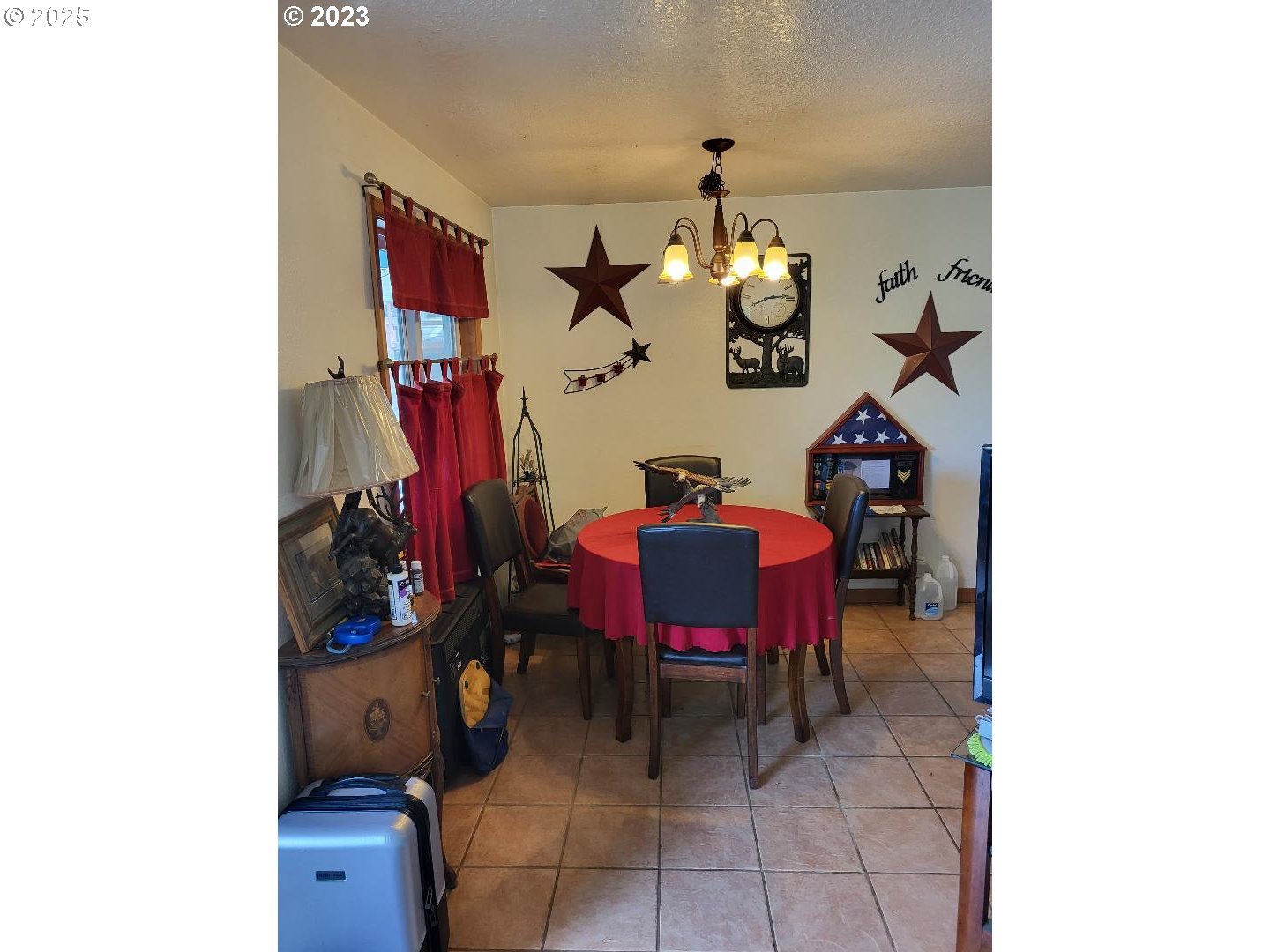 304 Hillcrest Drive John Day, OR 97845 - Photo 6 of 38 a view of a dining room with furniture and a chandelier