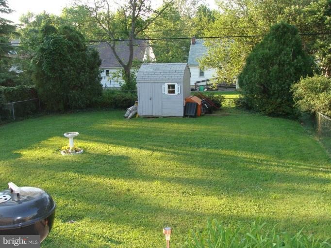 524 Shipley Road Linthicum Heights, MD 21090 - Photo 3 of 7 a view of a backyard with a garden and plants