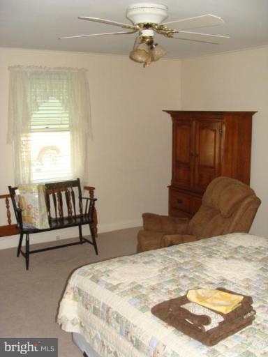 524 Shipley Road Linthicum Heights, MD 21090 - Photo 6 of 7 a bedroom with a bed and window