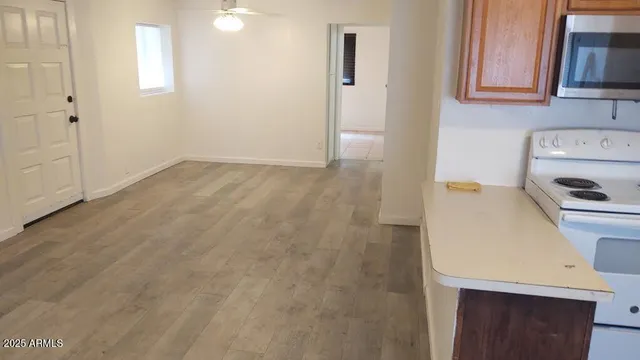 view of a kitchen with a sink and a refrigerator