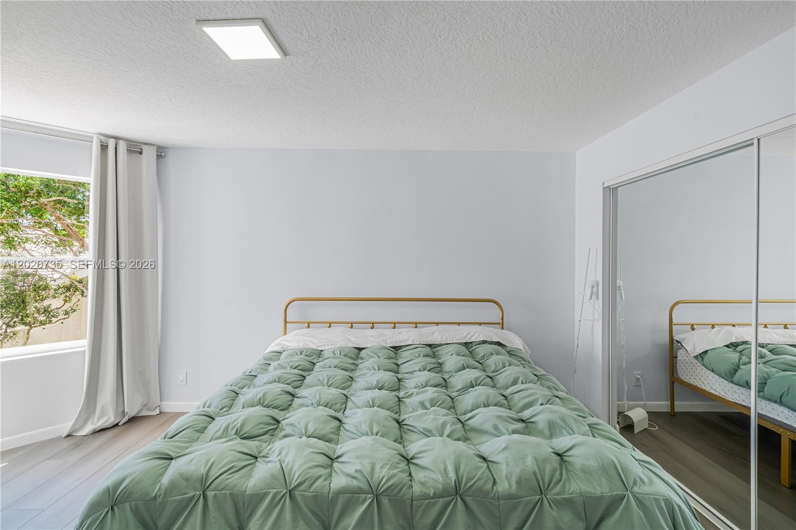17244 Balboa Point Way Boca Raton, FL 33487 - Photo 54 of 66 a bedroom with a bed and window