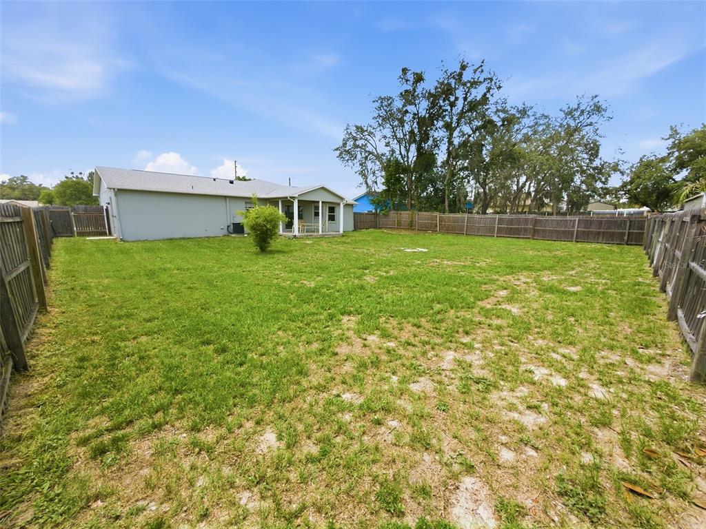 2202 Godfrey Avenue Spring Hill, FL 34609 - Photo 34 of 36 a view of a house with a yard