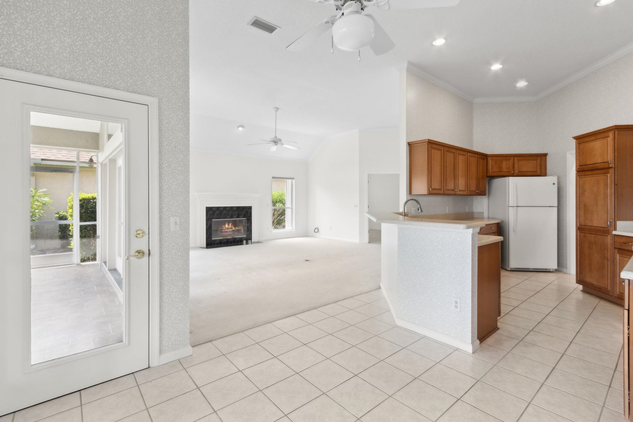 908 Birdie Way St. Augustine, FL 32080 - Photo 21 of 68 a view of kitchen with furniture and refrigerator
