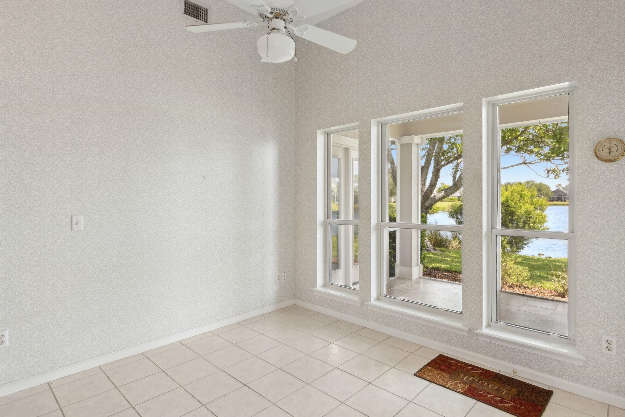 908 Birdie Way St. Augustine, FL 32080 - Photo 22 of 68 a view of an empty room with a window