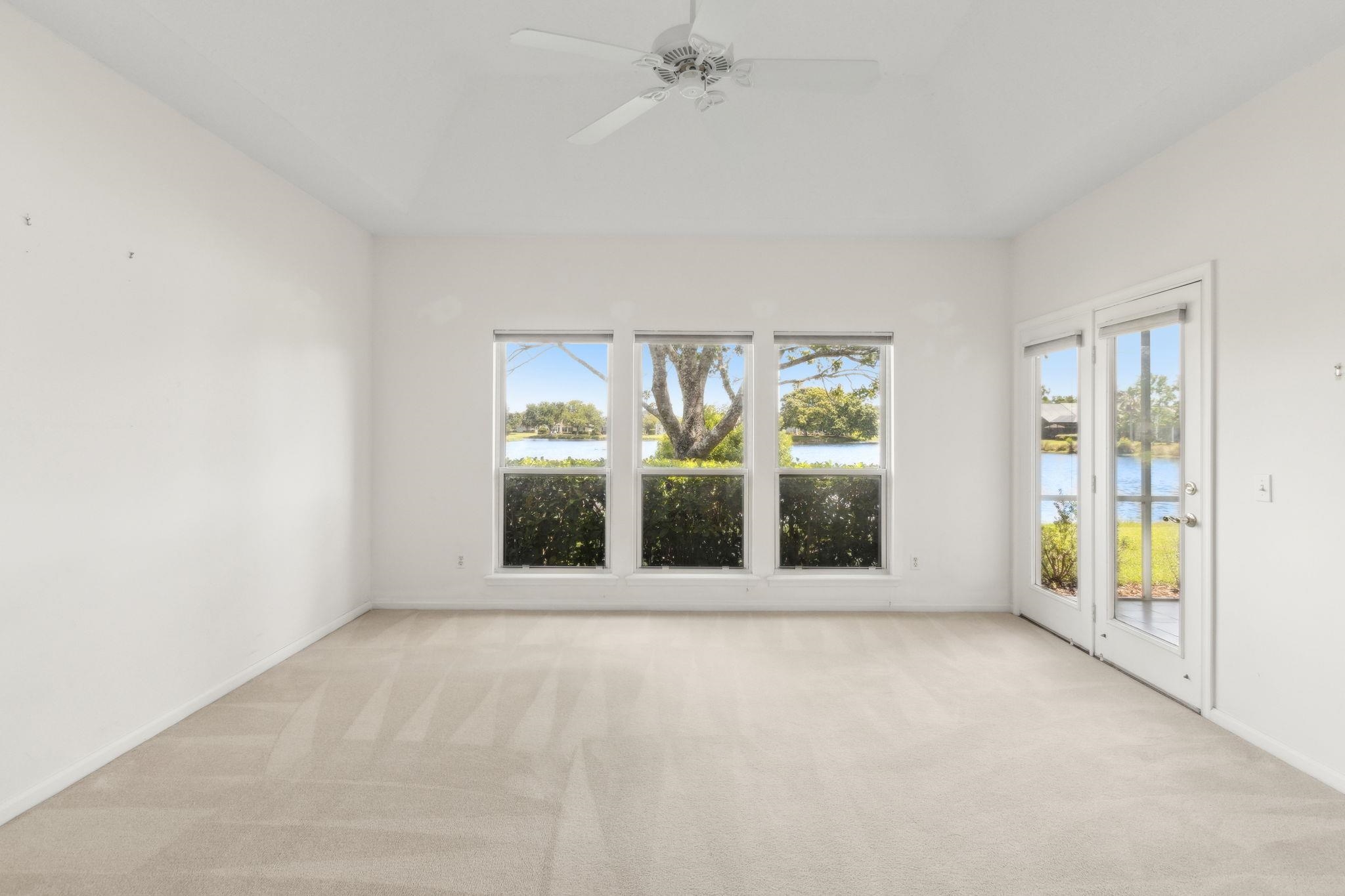 908 Birdie Way St. Augustine, FL 32080 - Photo 36 of 68 a view of an empty room with a window