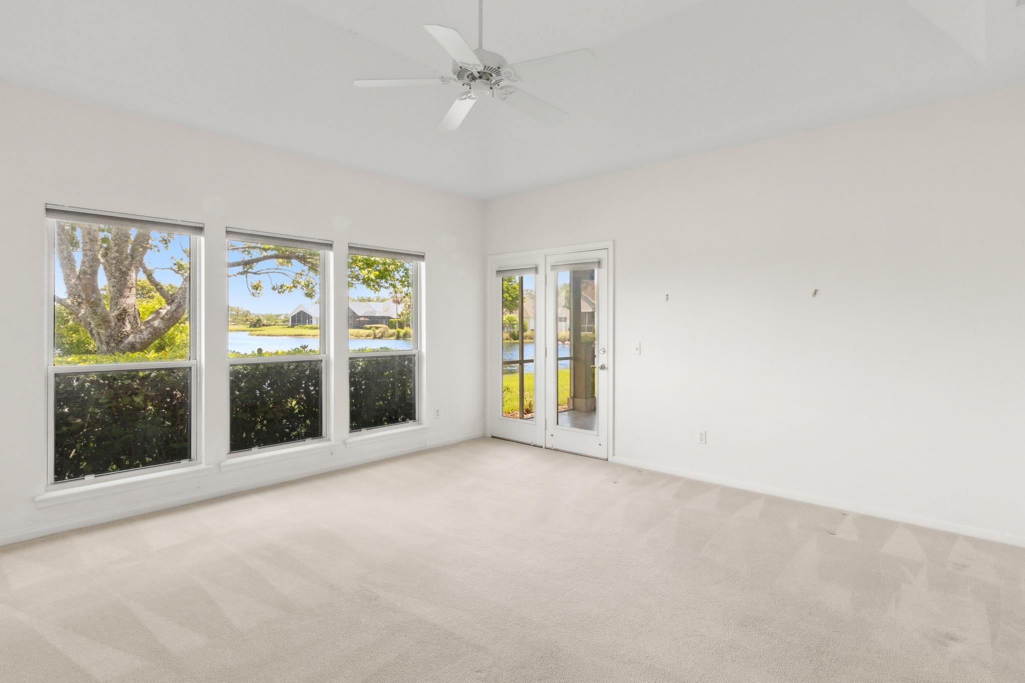 908 Birdie Way St. Augustine, FL 32080 - Photo 38 of 68 an empty room with windows