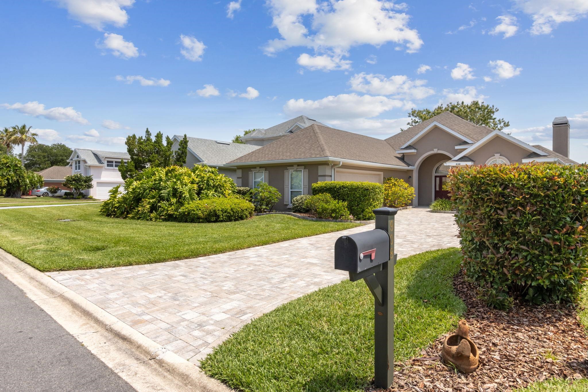 908 Birdie Way St. Augustine, FL 32080 - Photo 4 of 68 a front view of a house with garden