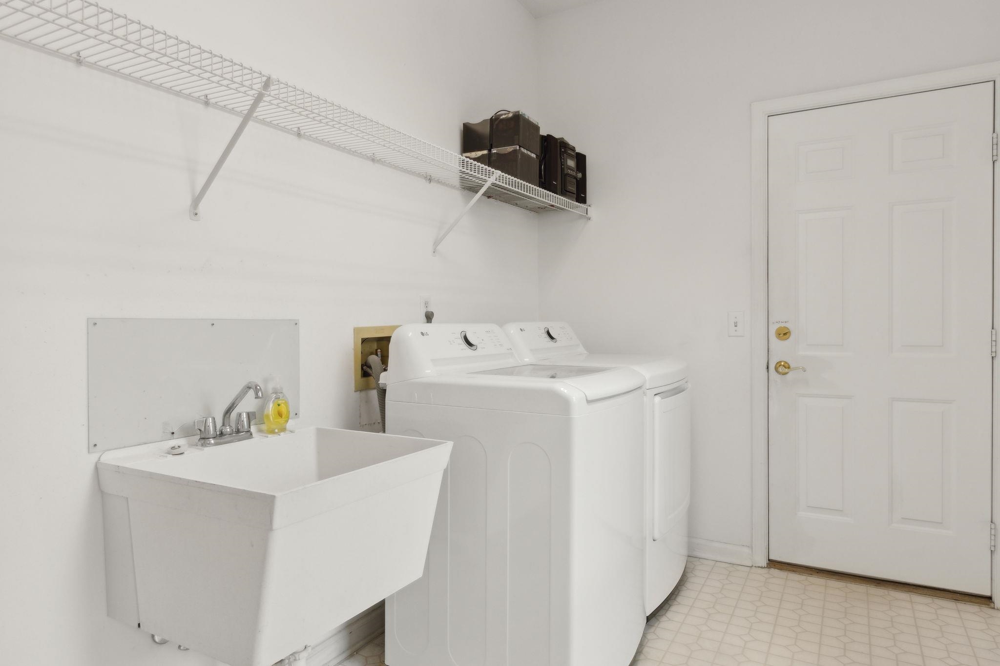 908 Birdie Way St. Augustine, FL 32080 - Photo 46 of 68 a utility room with dryer and washer