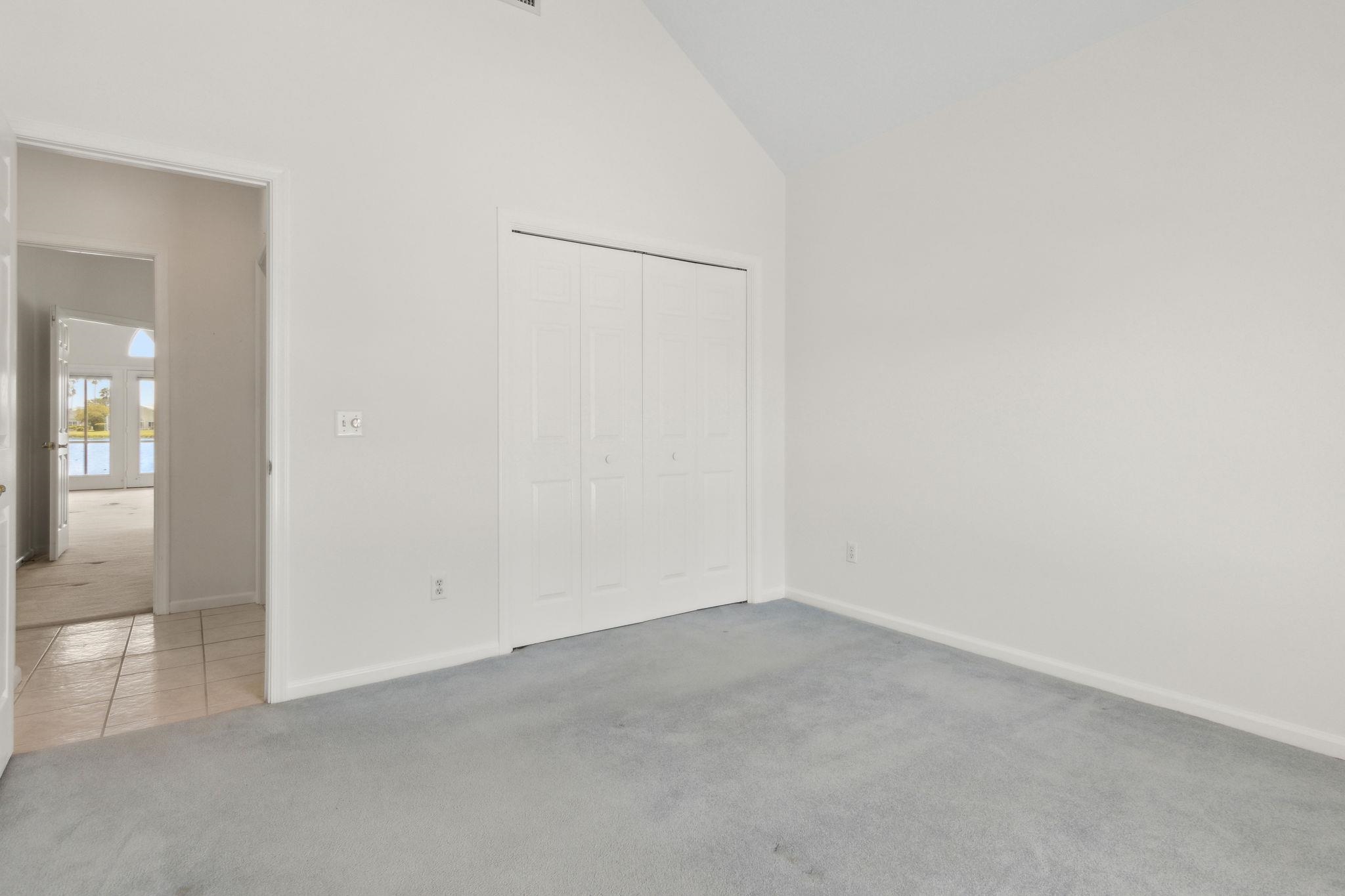 908 Birdie Way St. Augustine, FL 32080 - Photo 49 of 68 an empty room with mirror in it