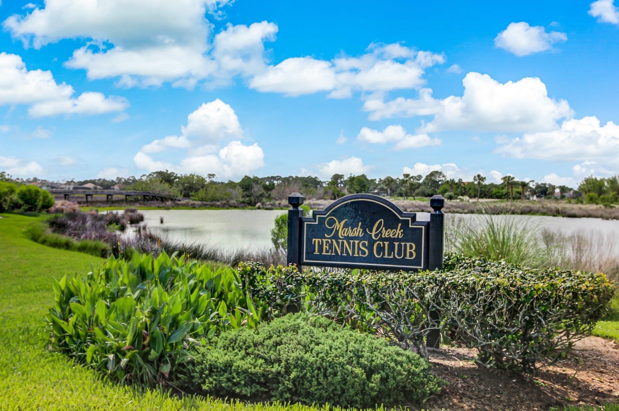 908 Birdie Way St. Augustine, FL 32080 - Photo 67 of 68 a view of a lake with houses in the back