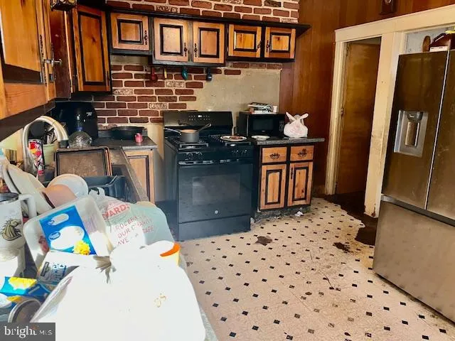 a bed sitting in a room next to a window