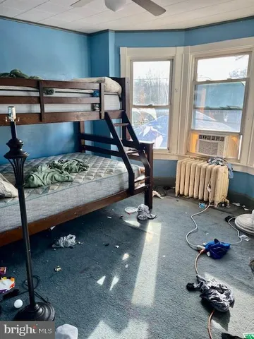 a room with a table chairs and entryway