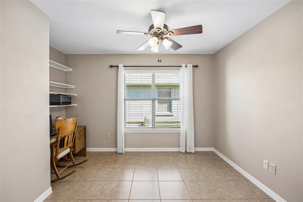 9221 Perimeter Street Denton, TX 76207 - Photo 15 of 36 a view of room with window and cabinet