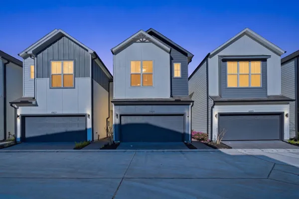 a front view of a house with a garage