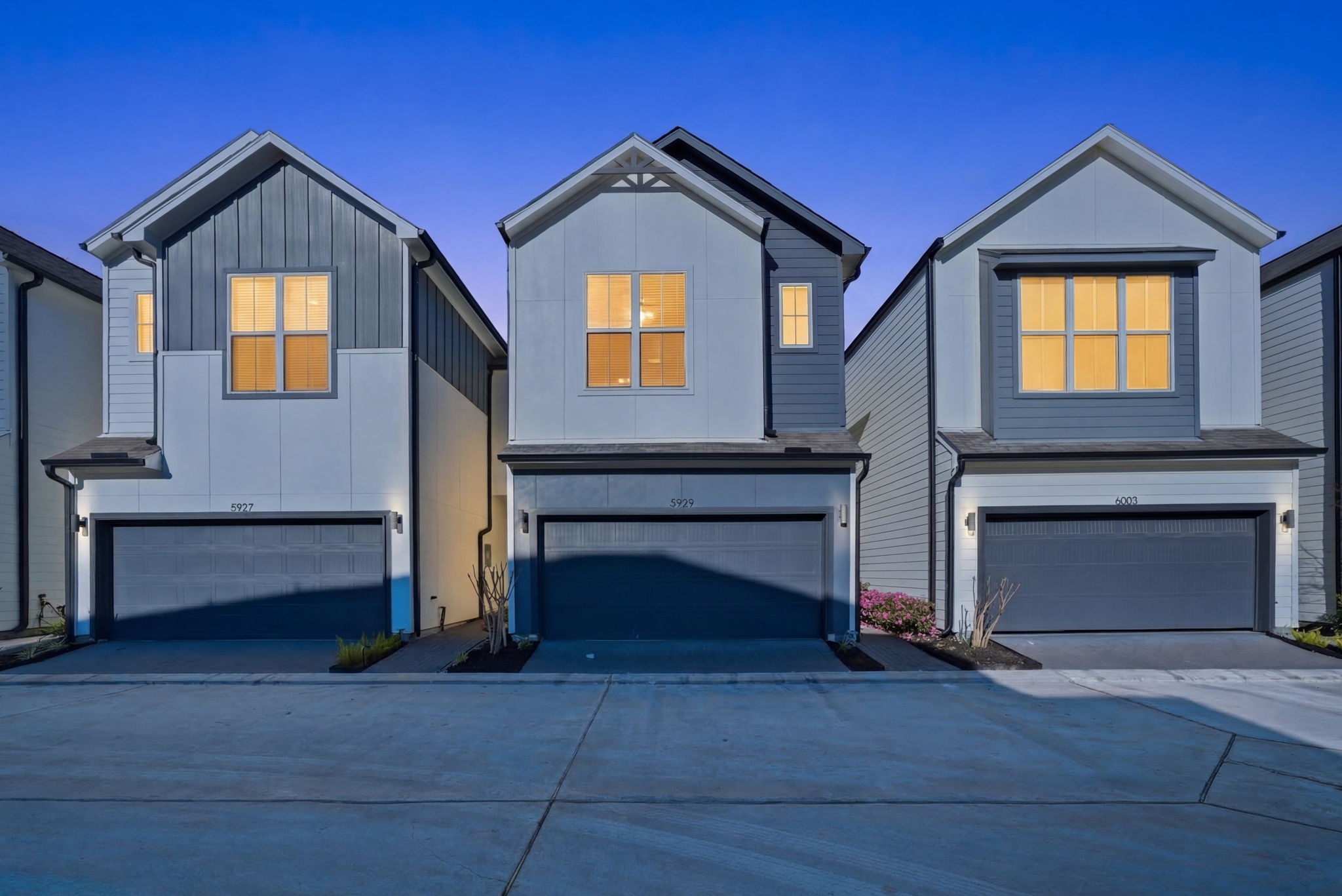 a front view of a house with a garage
