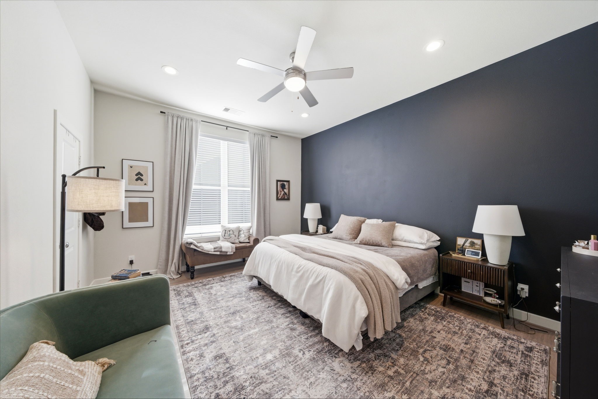 5929 Haring Lane Houston, TX 77091 - Photo 12 of 25 a bedroom with a bed couch and a window