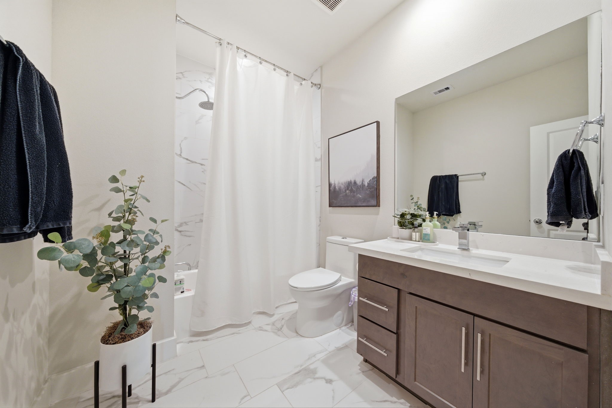 5929 Haring Lane Houston, TX 77091 - Photo 16 of 25 a bathroom with a toilet sink and shower curtain