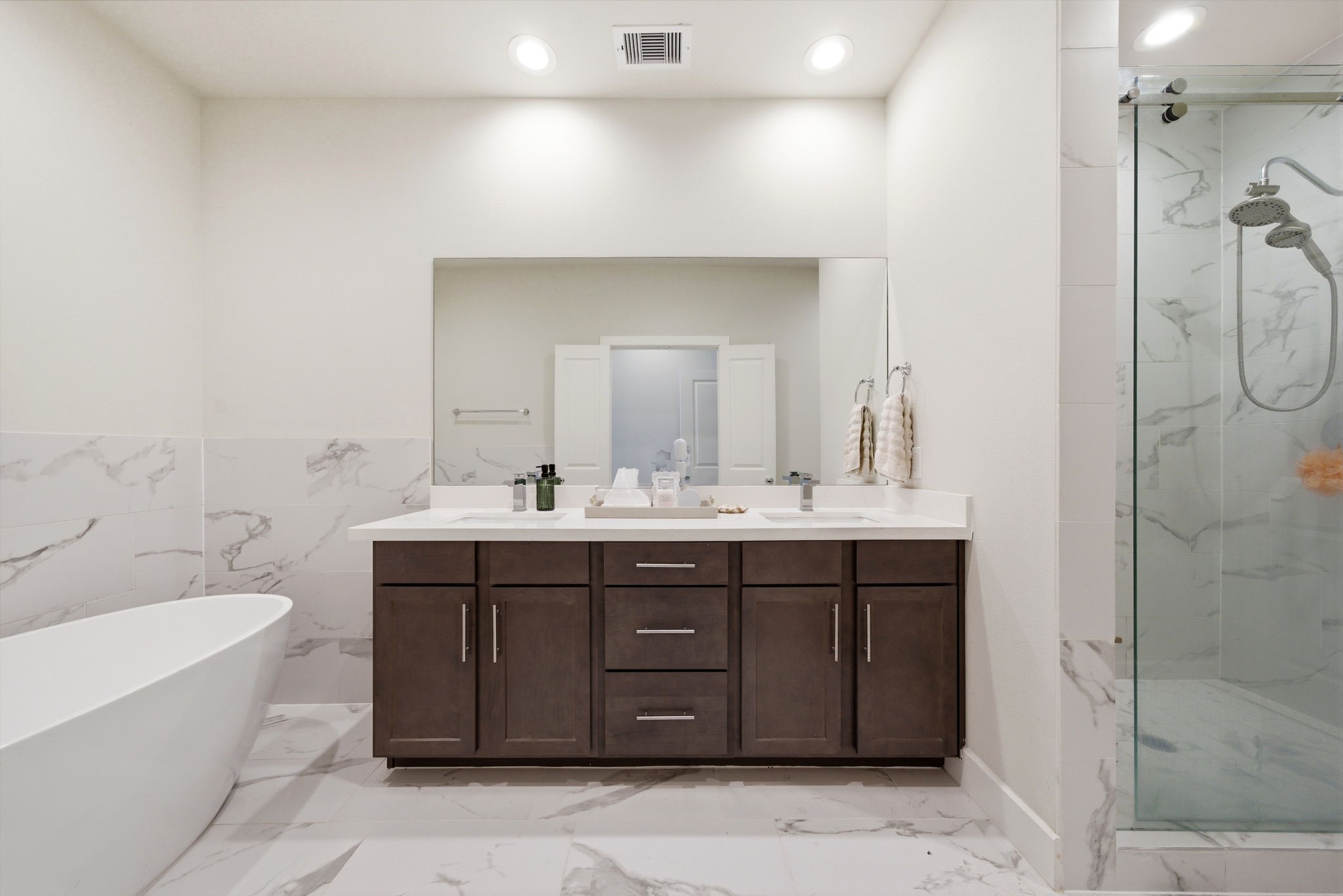 5929 Haring Lane Houston, TX 77091 - Photo 17 of 25 a bathroom with a double vanity sink mirror and toilet