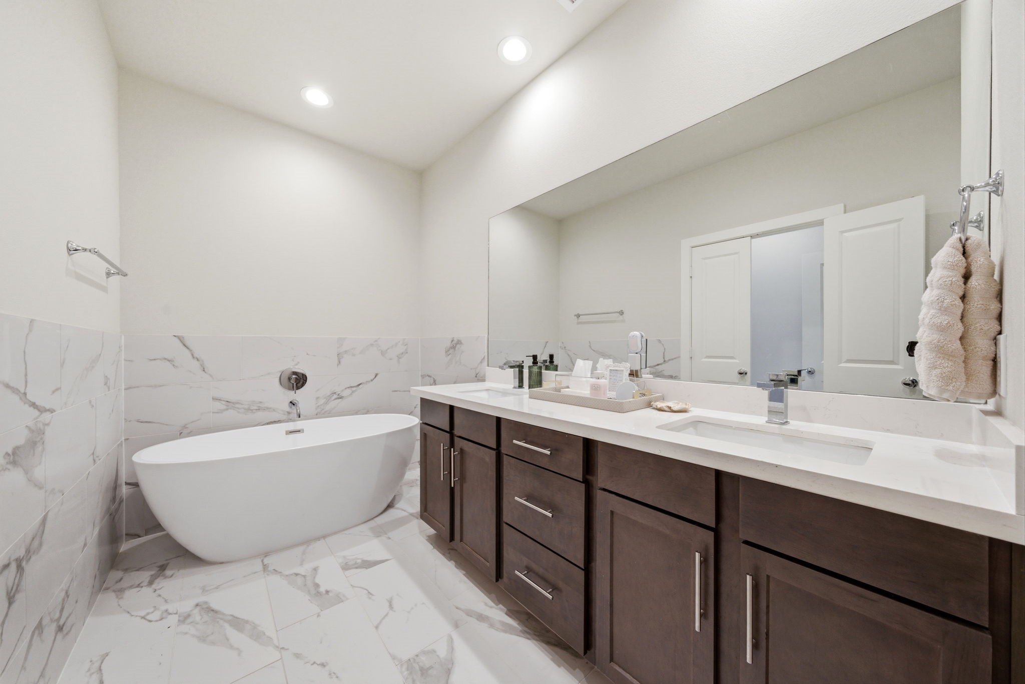 5929 Haring Lane Houston, TX 77091 - Photo 18 of 25 a spacious bathroom with a double vanity sink mirror and bathtub