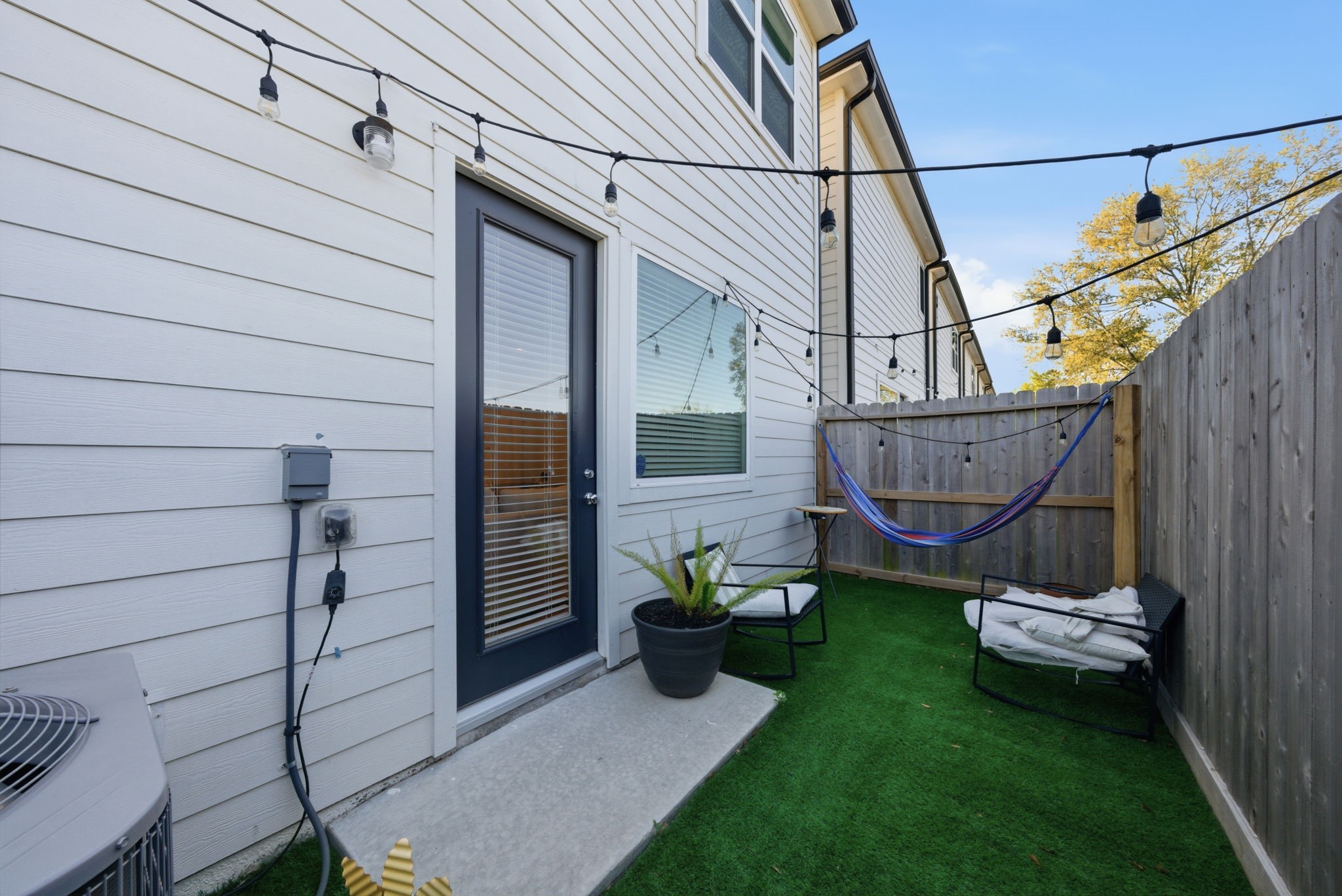 5929 Haring Lane Houston, TX 77091 - Photo 21 of 25 a view of a patio with table and chairs and wooden fence