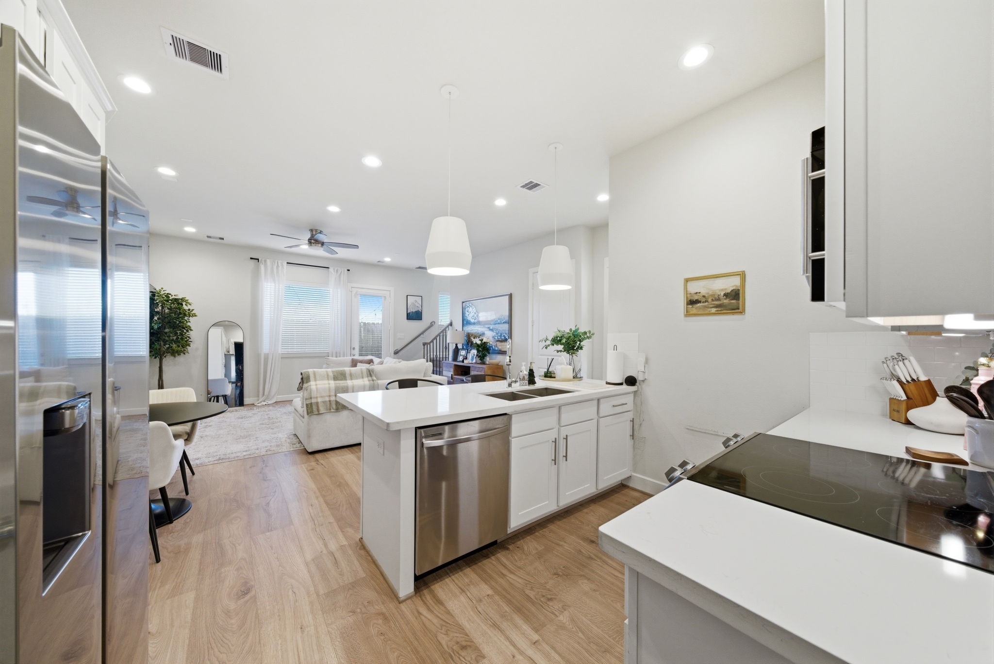 5929 Haring Lane Houston, TX 77091 - Photo 9 of 25 a kitchen with a sink a stove and cabinets
