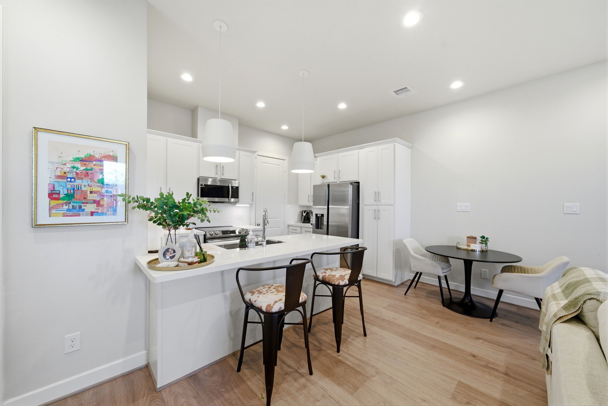 5929 Haring Lane Houston, TX 77091 - Photo 10 of 25 a living room with stainless steel appliances furniture a dining table and a microwave