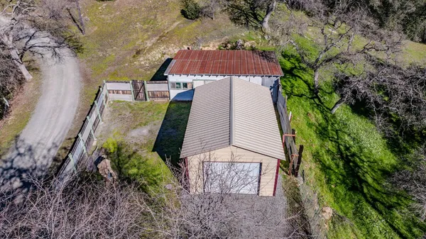 a aerial view of a house with a yard