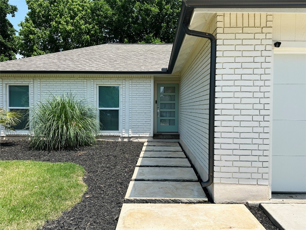 a view of a backyard of the house