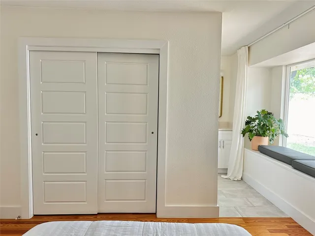 a view of bathroom with wooden floor