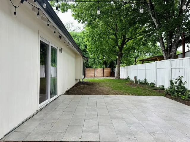 a view of backyard with green space