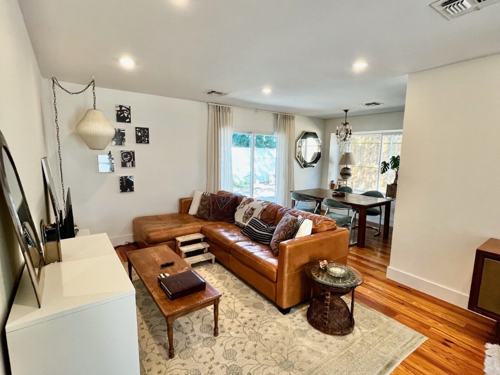 4504 West Village Court Austin, TX 78744 - Photo 3 of 18 a living room with furniture and a wooden floor