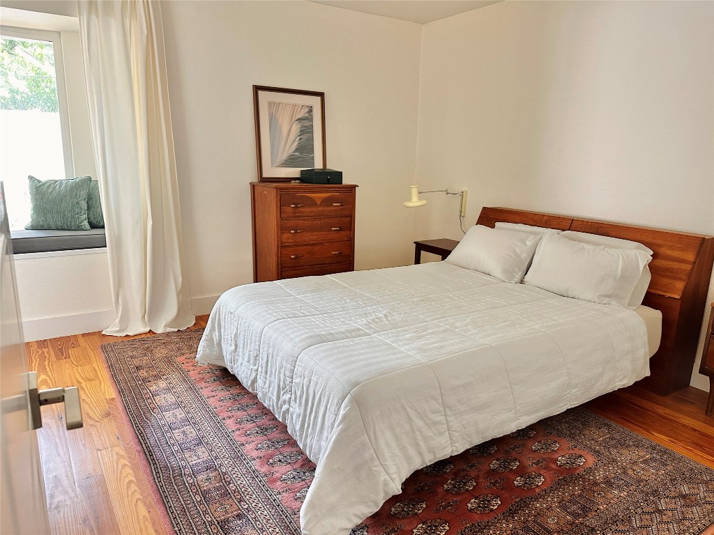 4504 West Village Court Austin, TX 78744 - Photo 5 of 18 a bedroom with a bed and a window