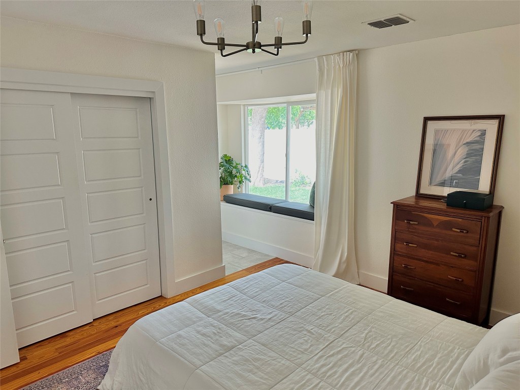 4504 West Village Court Austin, TX 78744 - Photo 6 of 18 a bedroom with a bed and a dresser