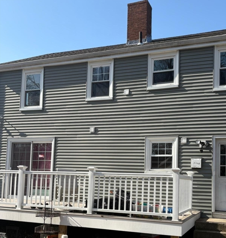 114 Faraday Street, Unit 2 Boston, MA 02136 - Photo 11 of 29 a view of a house that has a deck