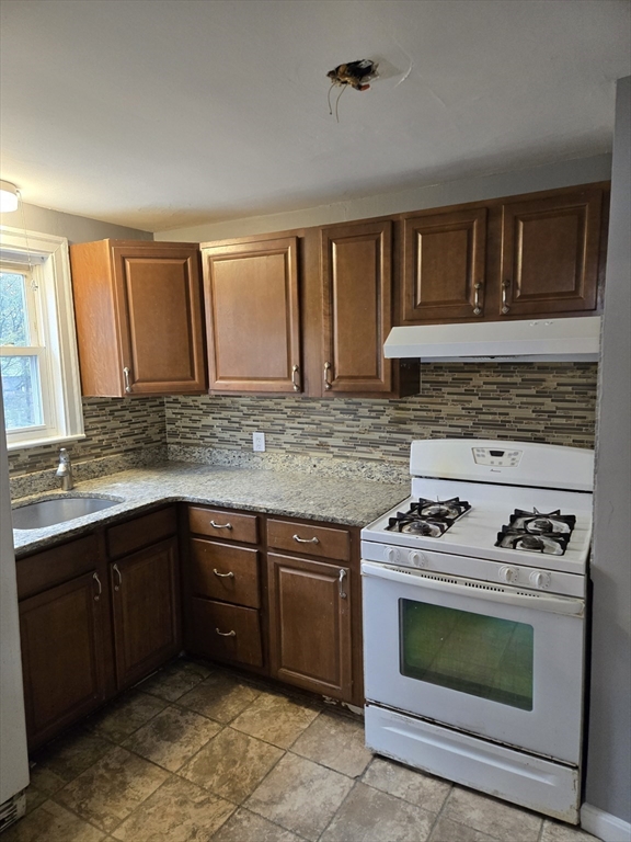 114 Faraday Street, Unit 2 Boston, MA 02136 - Photo 12 of 25 a kitchen with a stove and a sink