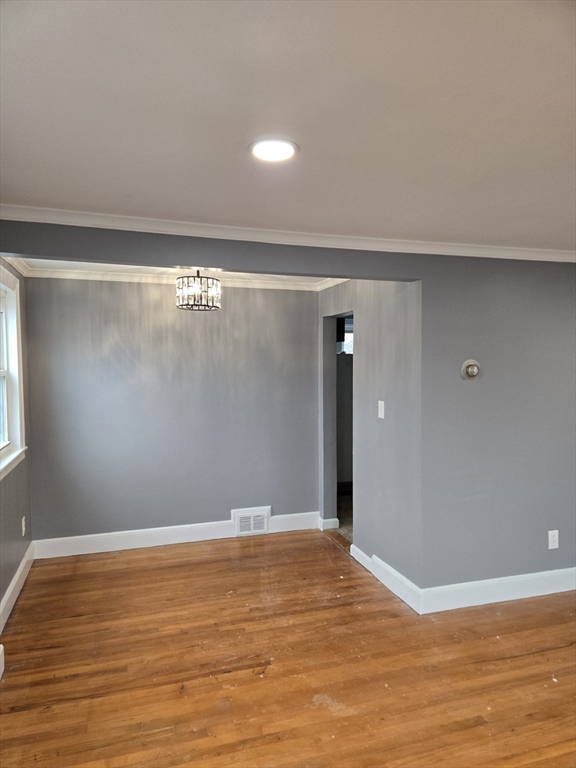 114 Faraday Street, Unit 2 Boston, MA 02136 - Photo 17 of 29 a view of an empty room with wooden floor