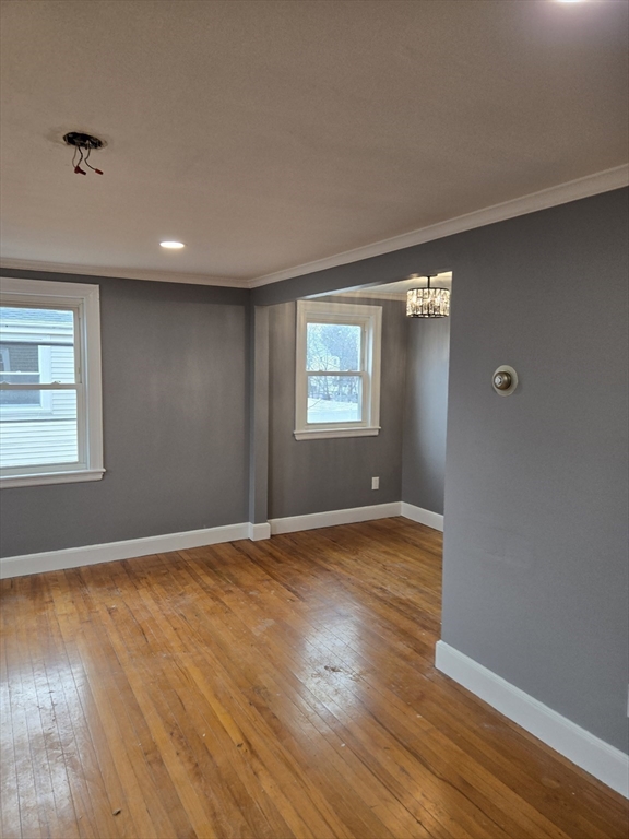 114 Faraday Street, Unit 2 Boston, MA 02136 - Photo 18 of 29 a view of an empty room with wooden floor and a window