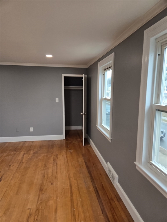 114 Faraday Street, Unit 2 Boston, MA 02136 - Photo 19 of 29 a view of an empty room with wooden floor and a window