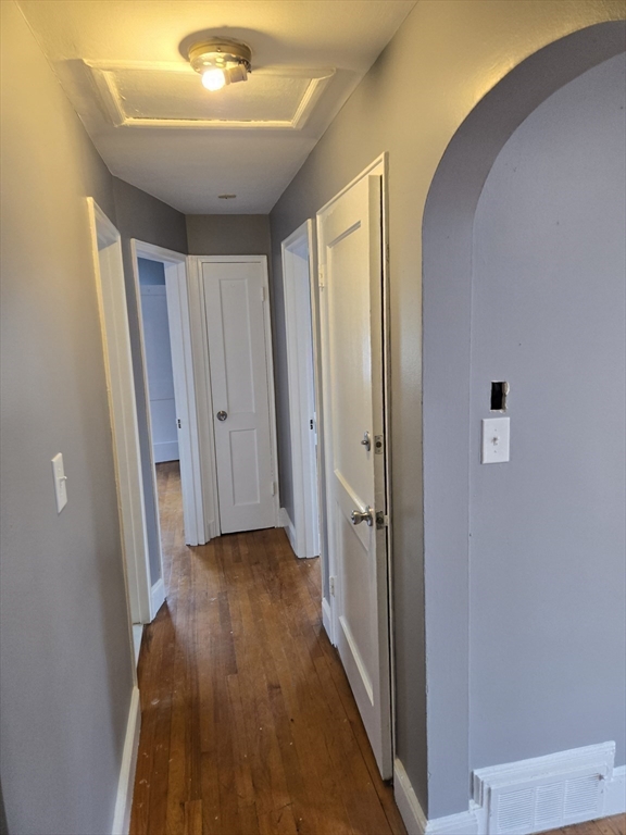 114 Faraday Street, Unit 2 Boston, MA 02136 - Photo 23 of 29 a view of a hallway with wooden floor