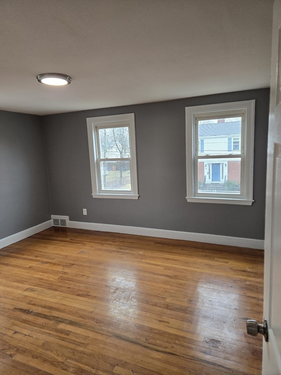 114 Faraday Street, Unit 2 Boston, MA 02136 - Photo 28 of 29 a view of a room with wooden floor and window