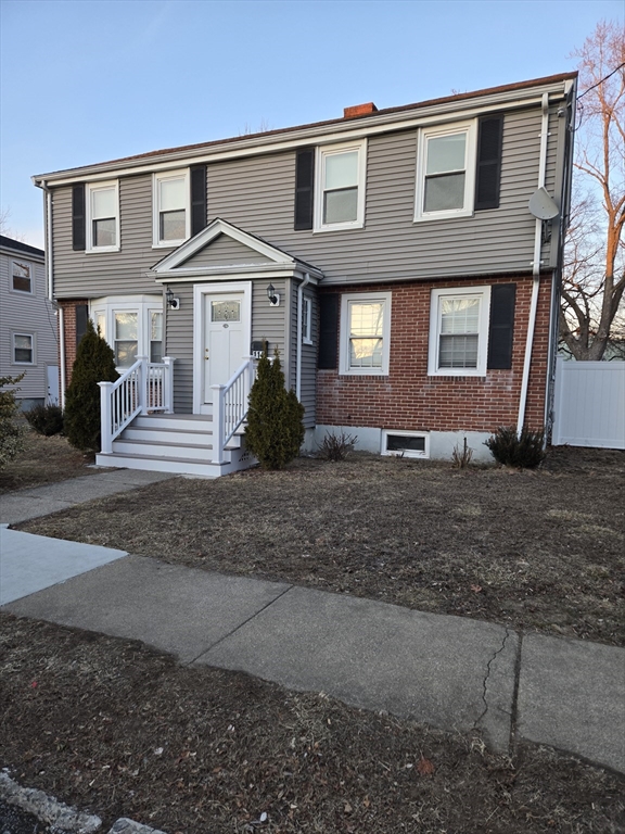 114 Faraday Street, Unit 2 Boston, MA 02136 - Photo 4 of 25 a front view of a house with a yard