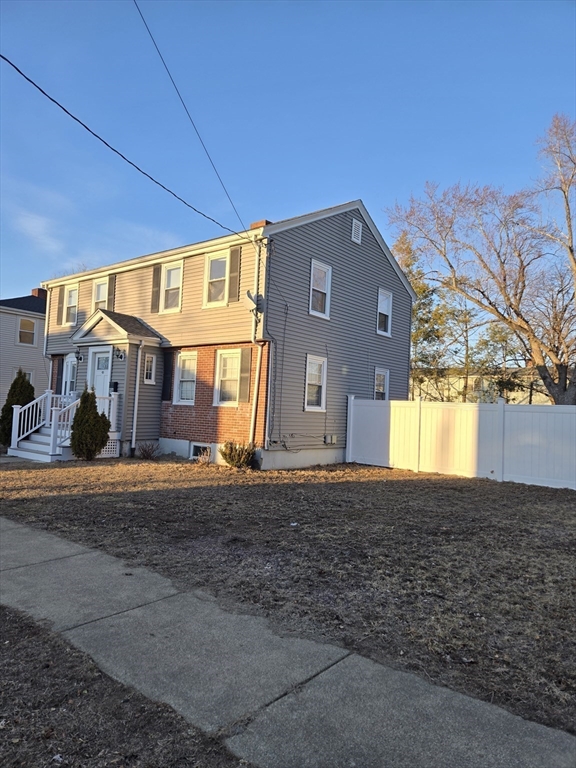 114 Faraday Street, Unit 2 Boston, MA 02136 - Photo 6 of 25 a front view of a house with a yard