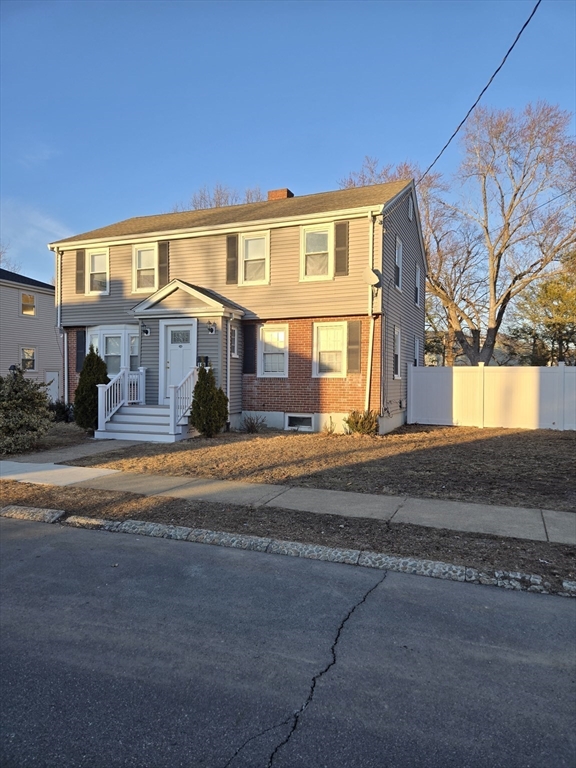114 Faraday Street, Unit 2 Boston, MA 02136 - Photo 8 of 29 a front view of a house with a yard