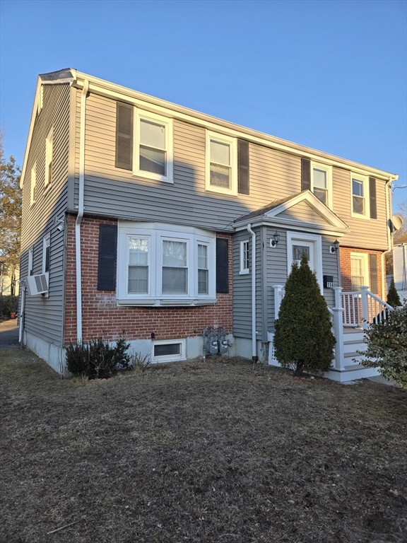 114 Faraday Street, Unit 2 Boston, MA 02136 - Photo 9 of 29 a front view of a house with a garden